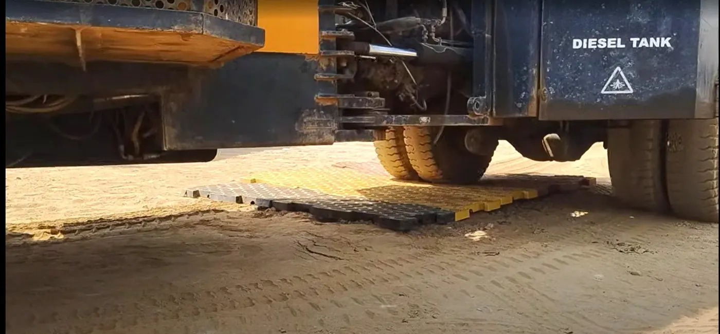 A loaded truck on the yellow mats