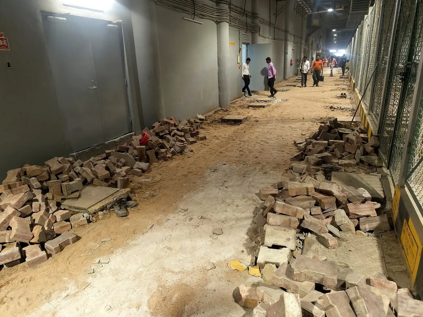 Before: the broken paver corridor