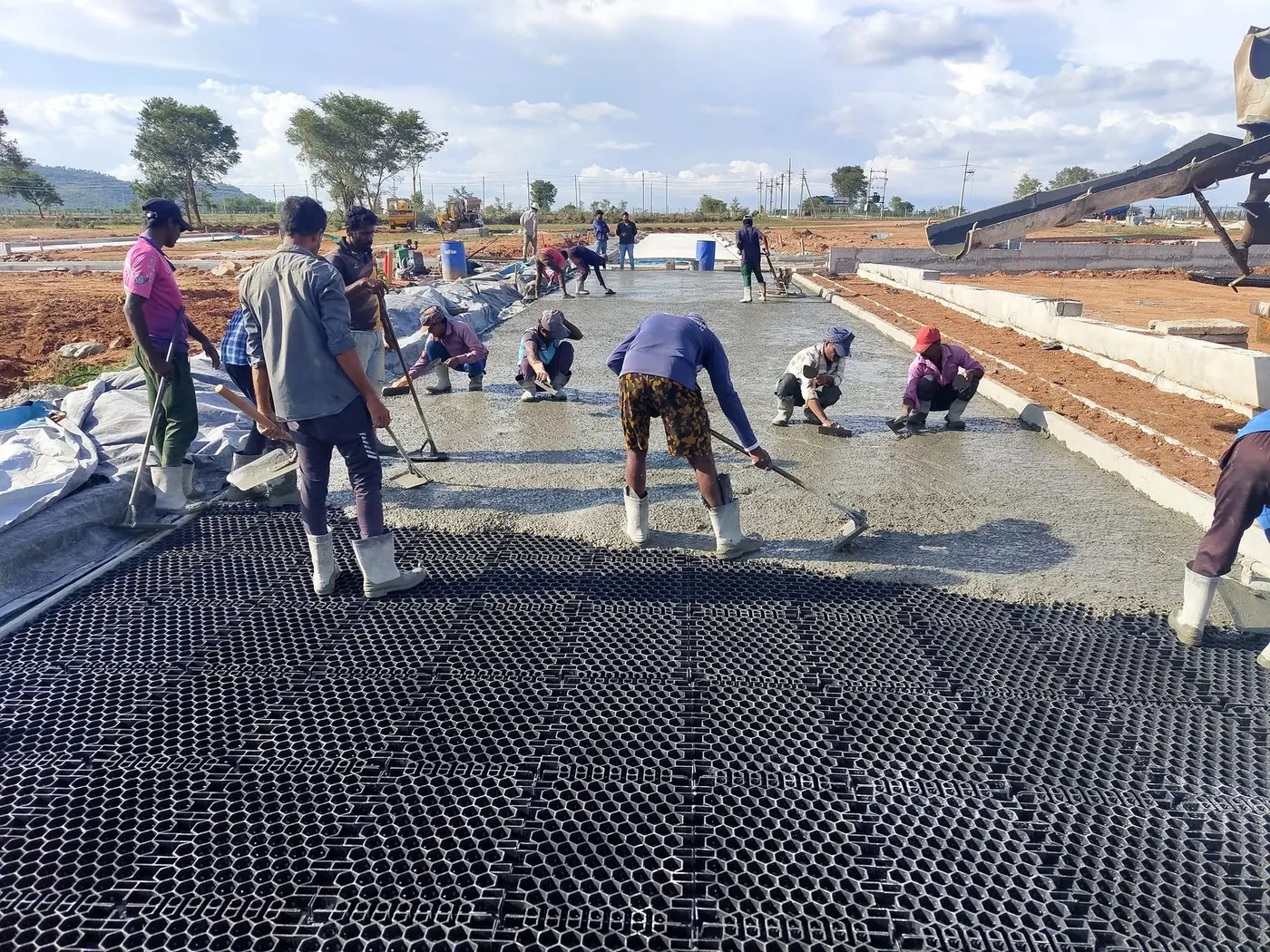 Concrete placed and finished flush with the cell tops