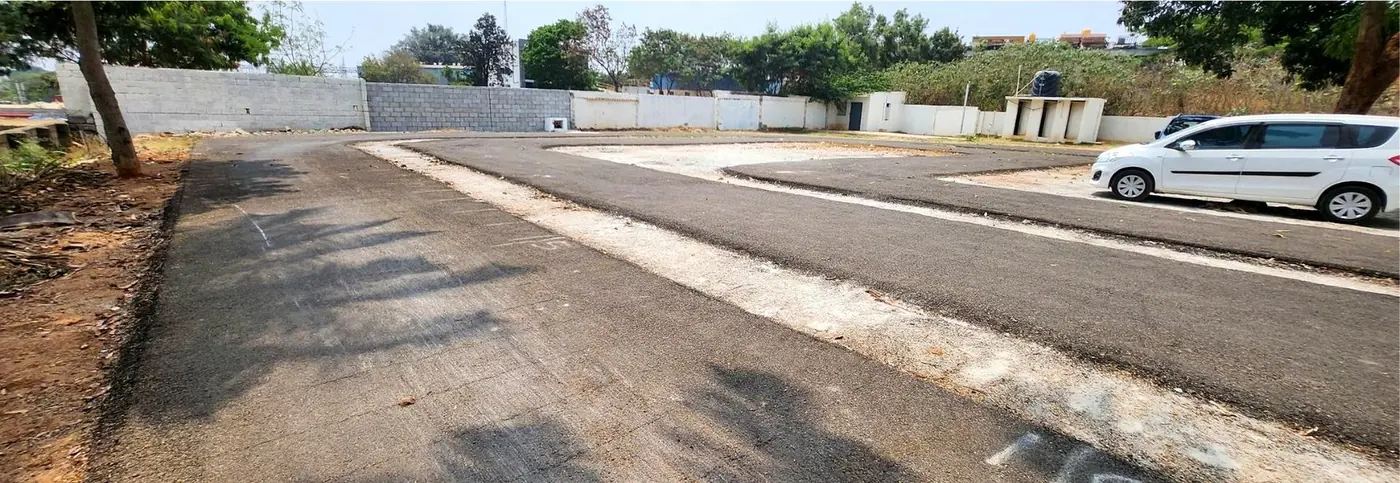 Orxa Energies campus, Bengaluru: asphalt road over OC-HD 40 at the WMM/GSB interface
