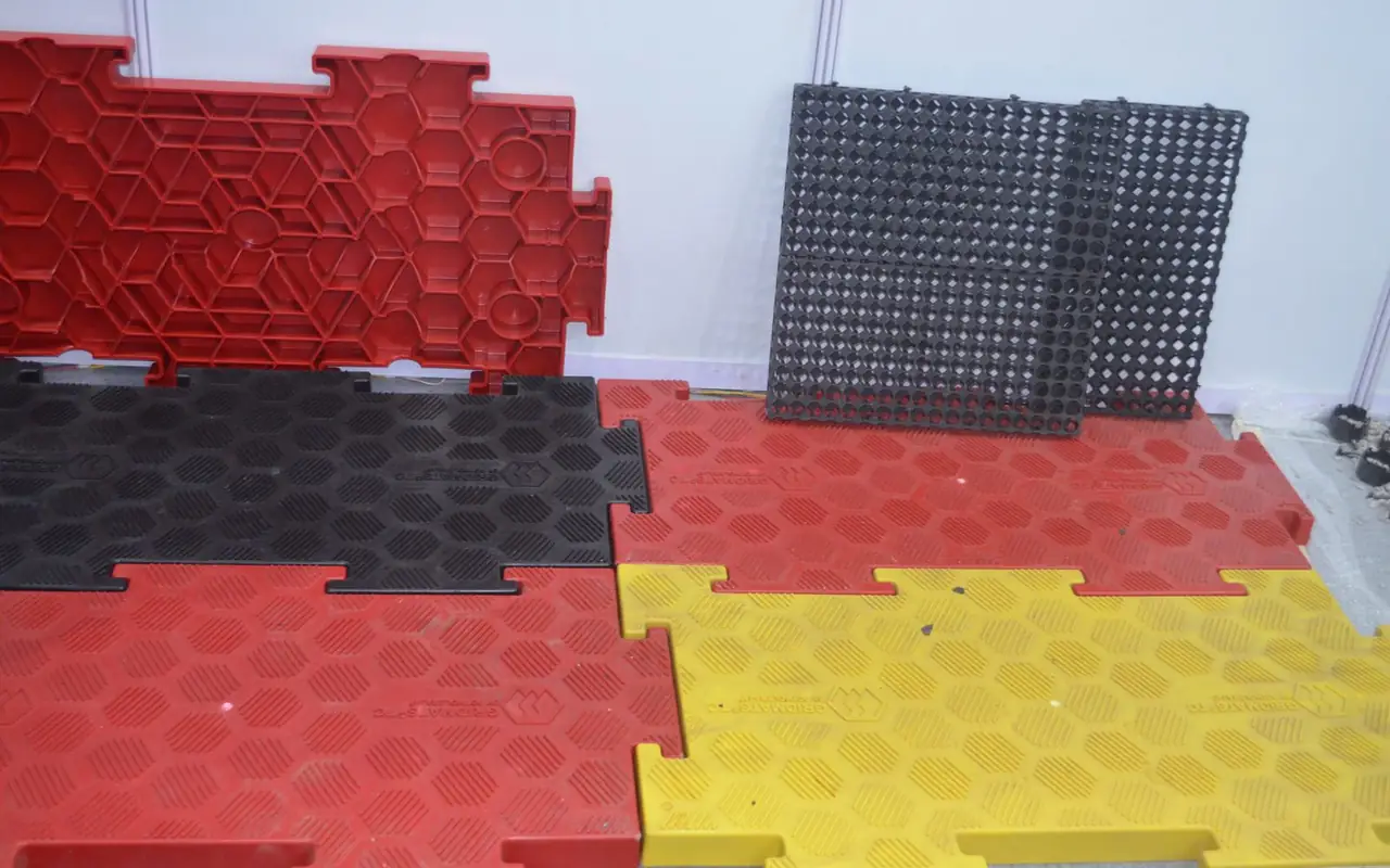 Red, yellow and black top-covered mats locked together