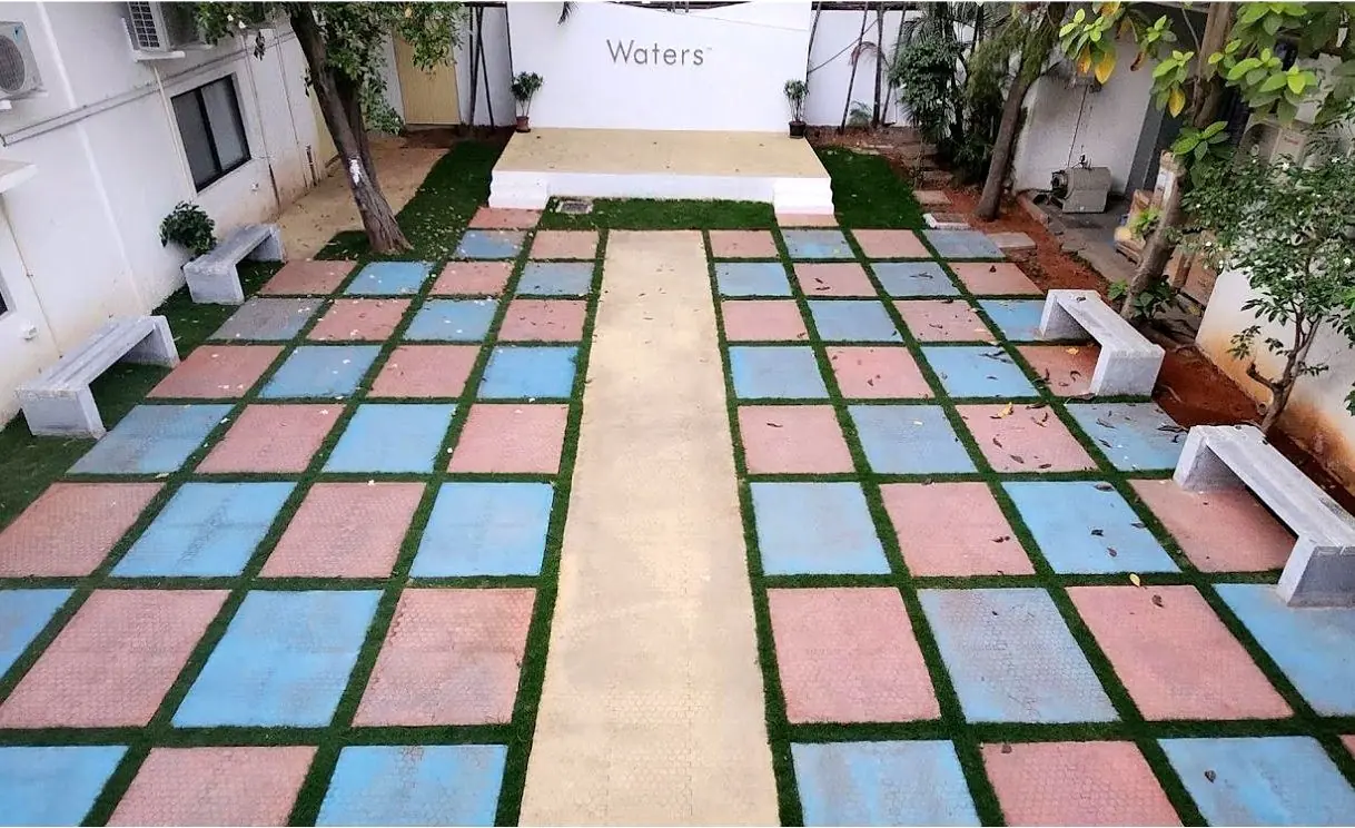 Waters India, Bengaluru: grass and paved squares either side of a walkway